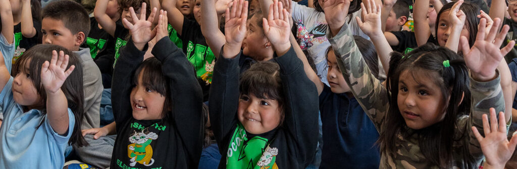 students reaching for the sky